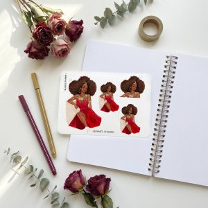 Sekhmet Black girl sticker sheet on lined notebook with dried roses and tea on linen